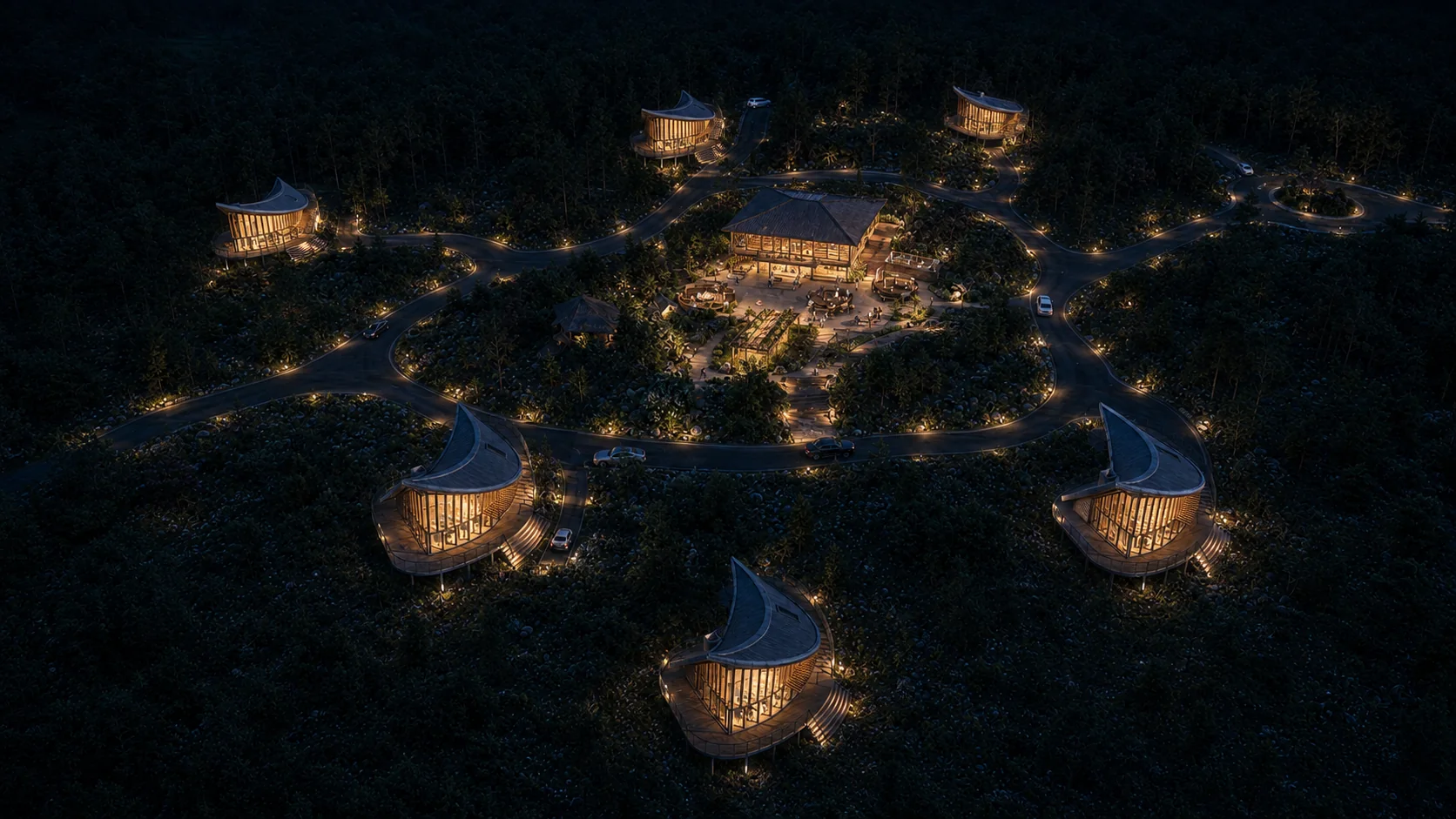 Cabin retreat aerial at night with warm lighting between the trees